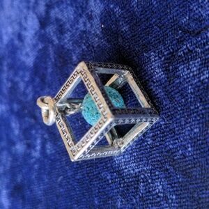 Unique vintage pendant with enclosed blue turquoise (?) stone